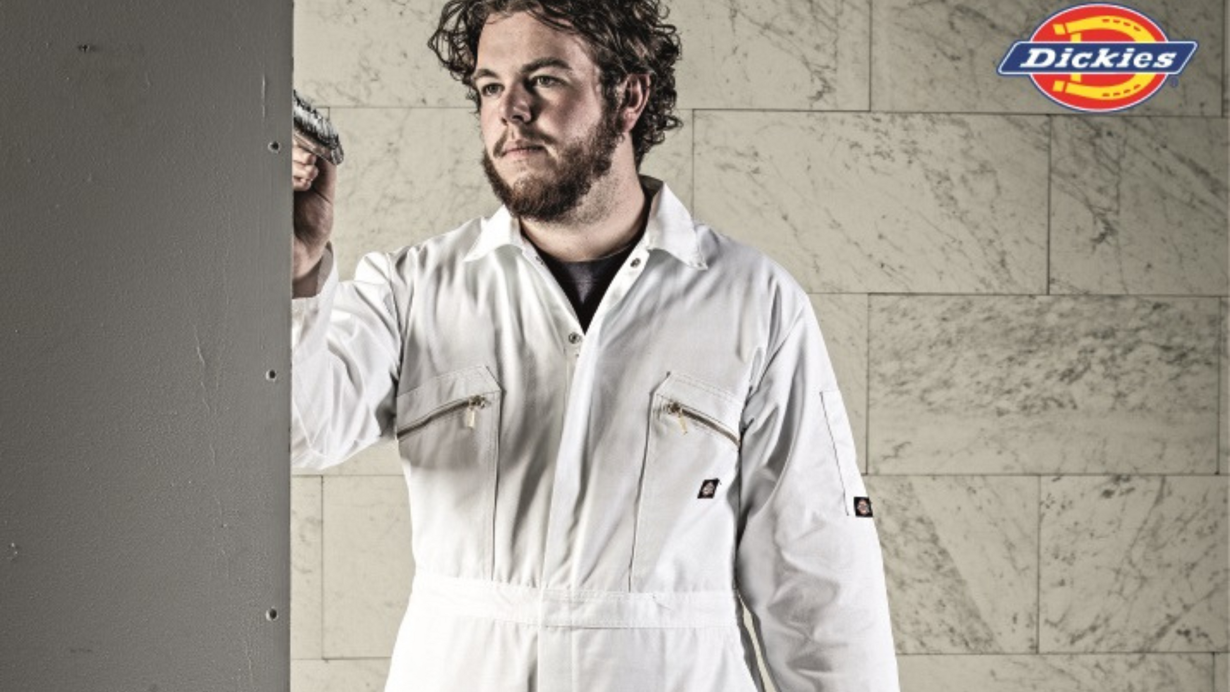 A dickies model wearing white overall for workweargurus.com