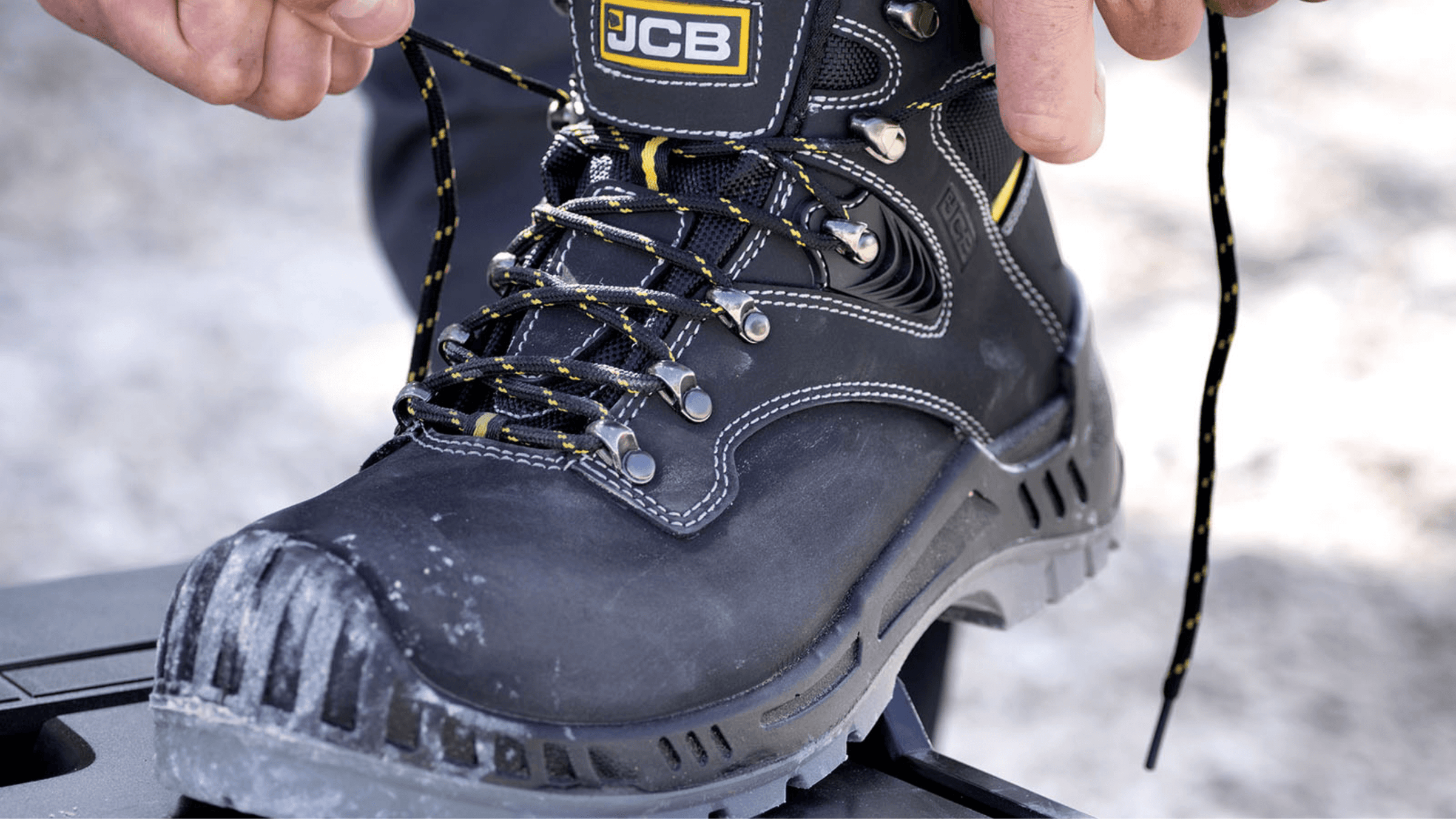 An image of someone wearing JCB Boots