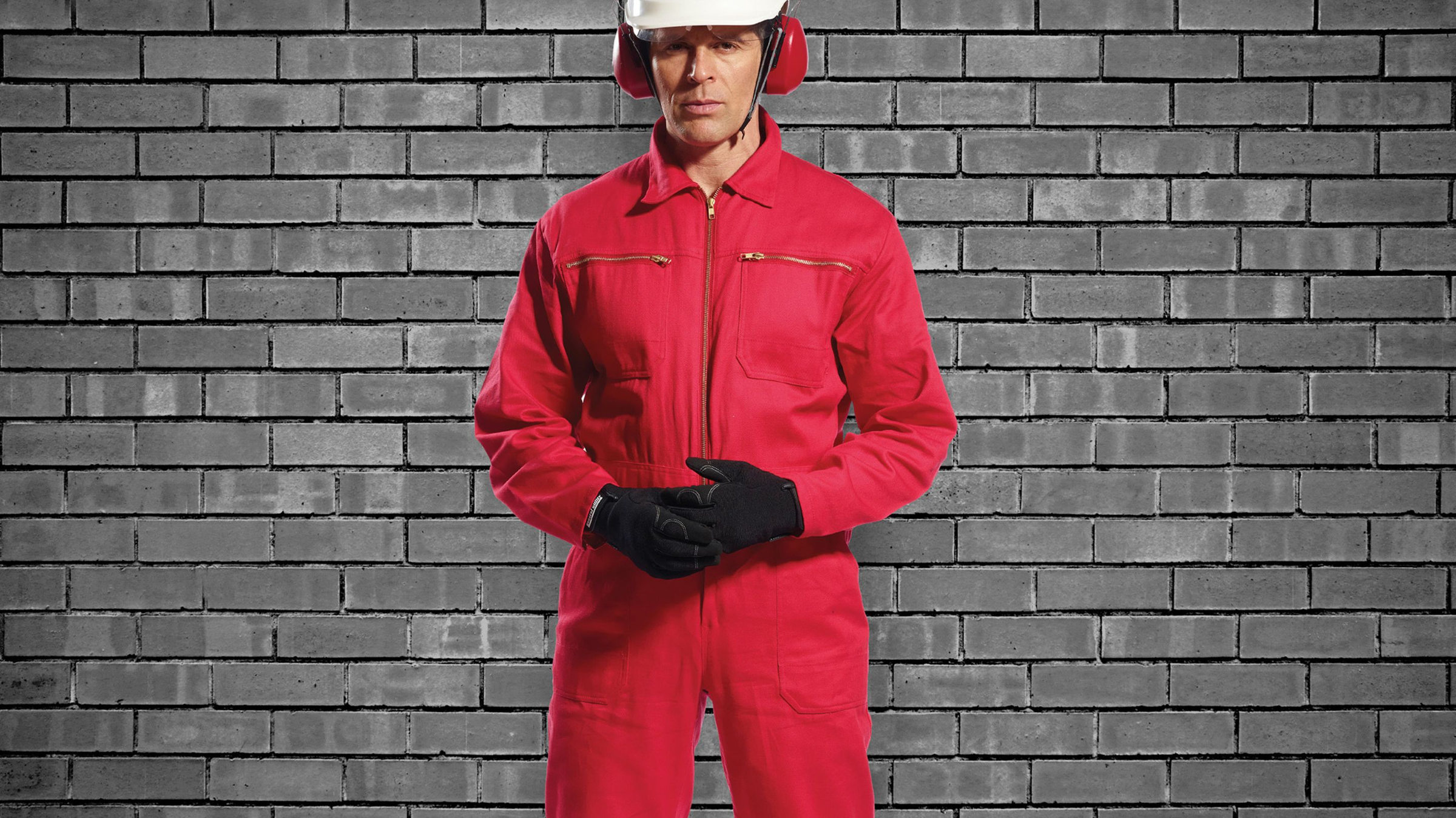 An image of a model wearing Portwest coveralls