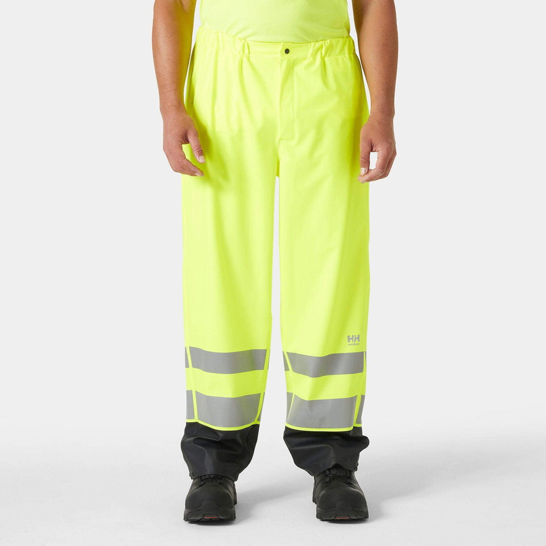 Helly Hansen Addvis Hi-Vis Waterproof Rain Trousers Yellow/Ebony OnBody 1#colour_yellow-ebony