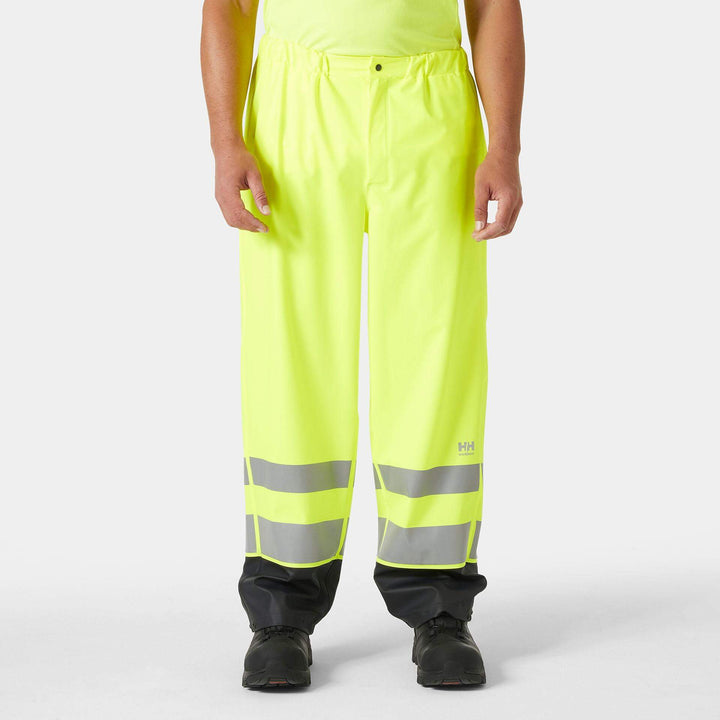Helly Hansen Addvis Hi-Vis Waterproof Rain Trousers Yellow/Ebony OnBody 1#colour_yellow-ebony
