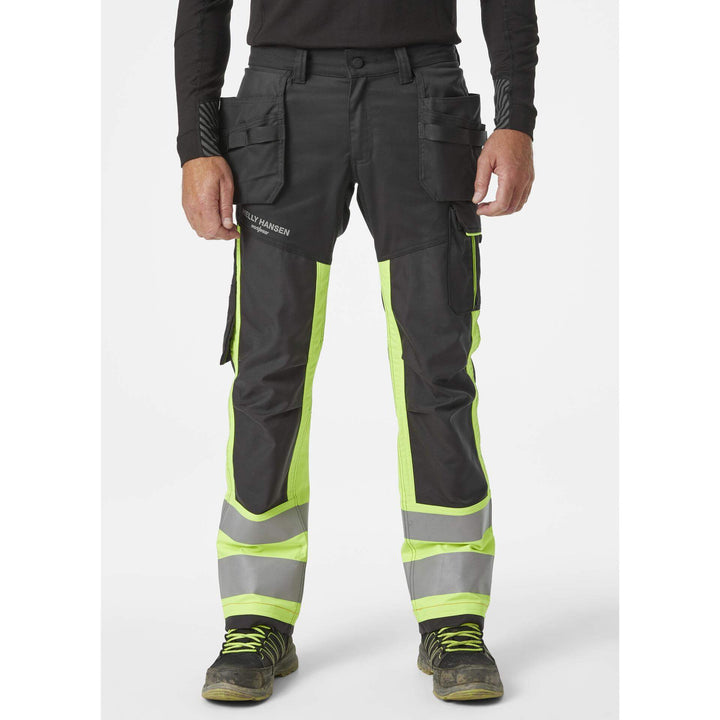 Helly Hansen Alna 2.0 Hi Vis Construction Stretch Trousers Class 1 Yellow/Ebony 3 On Body 1#colour_yellow-ebony