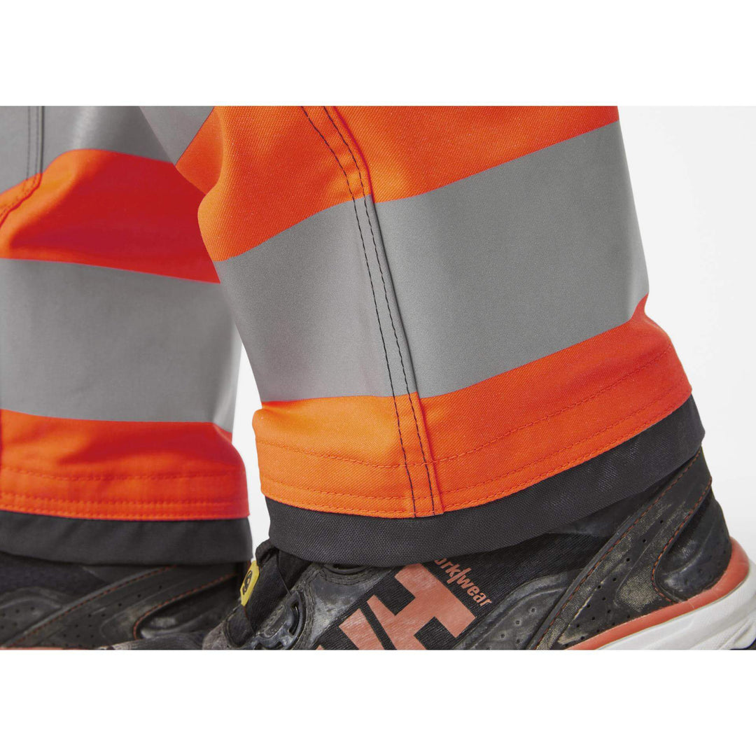 Helly Hansen Alna 2.0 Hi Vis Stretch Work Trousers Class 1 Orange/Ebony 7 Feature 3#colour_orange-ebony