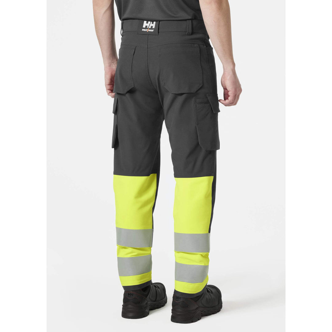 Helly Hansen Alna 4X Hi-Vis 4-Way-Stretch Cargo Trousers Class 1 Yellow/Ebony OnBody 2#colour_yellow-ebony