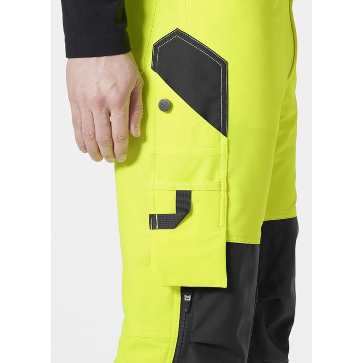 Helly Hansen Alna 4X Hi-Vis 4-Way-Stretch Work Trousers Class 2 Yellow/Ebony Feature 3#colour_yellow-ebony