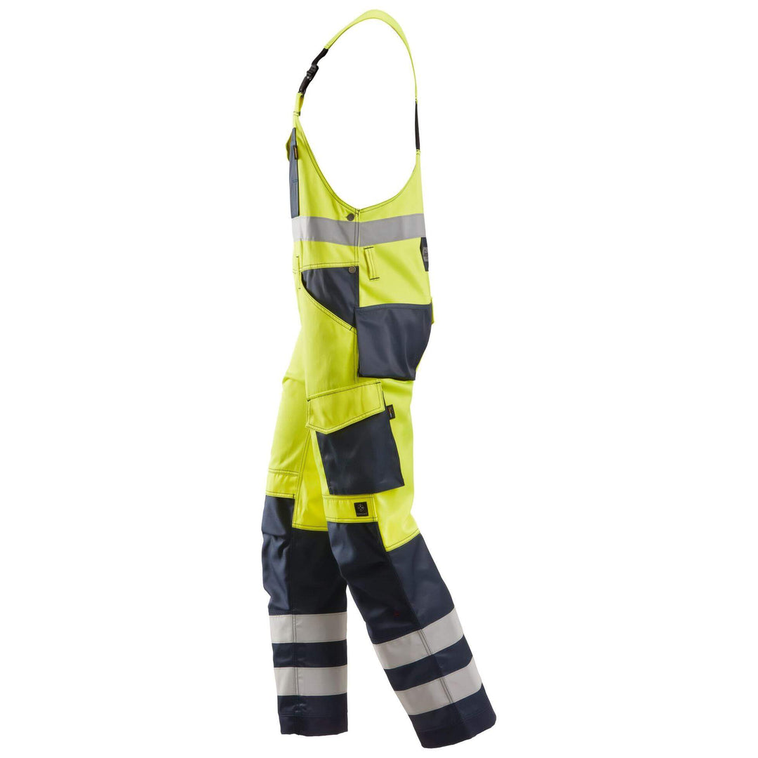 Snickers 0113 Hi Vis Bib and Brace Cordura Trousers Class 2 Hi Vis Yellow Navy Blue left #colour_hi-vis-yellow-navy-blue