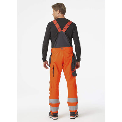 Helly Hansen Alna 2.0 Hi Vis Waterproof Shell Construction Bib and Brace Trousers Class 2 Orange/Ebony 4 On Body 2#colour_orange-ebony