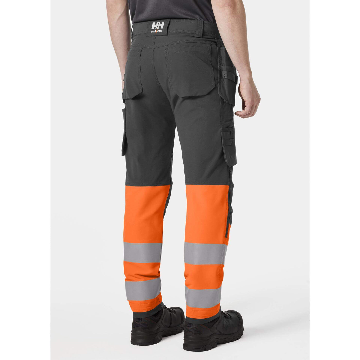Helly Hansen Alna 4X Hi-Vis 4-Way-Stretch Construction Trousers Class 1 Orange/Ebony OnBody 2#colour_orange-ebony