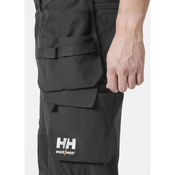 Helly Hansen Alna 4X Hi-Vis 4-Way-Stretch Construction Trousers Class 1 Orange/Ebony Feature 1#colour_orange-ebony