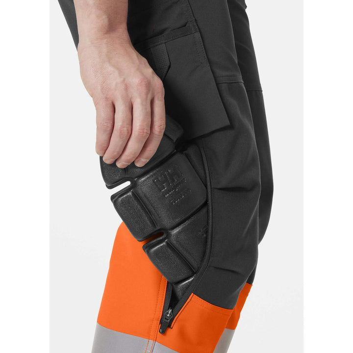 Helly Hansen Alna 4X Hi-Vis 4-Way-Stretch Construction Trousers Class 1 Orange/Ebony Feature 2#colour_orange-ebony