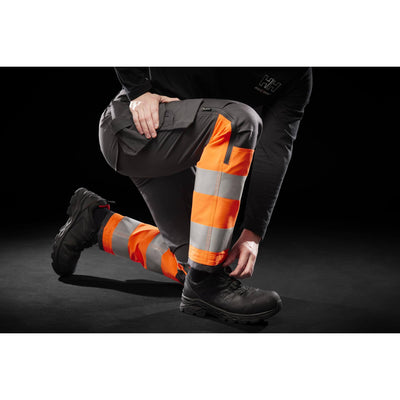 Helly Hansen Alna 4X Hi-Vis 4-Way-Stretch Construction Trousers Class 1 Orange/Ebony Detail 1#colour_orange-ebony