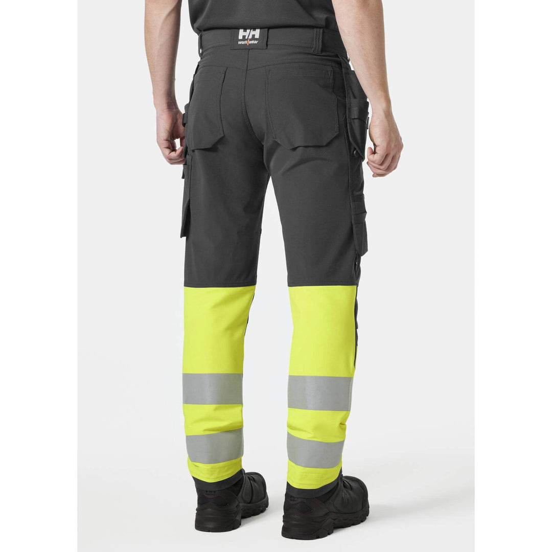 Helly Hansen Alna 4X Hi-Vis 4-Way-Stretch Construction Trousers Class 1 Yellow/Ebony OnBody 2#colour_yellow-ebony