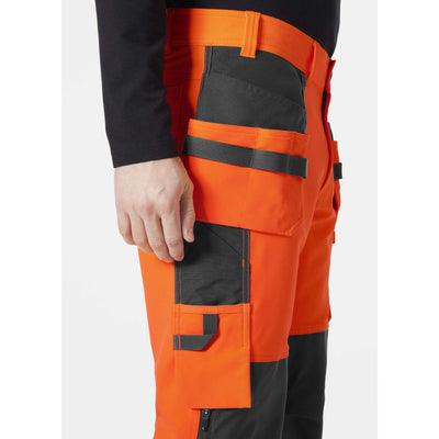 Helly Hansen Alna 4X Hi-Vis 4-Way-Stretch Construction Trousers Class 2 Orange/Ebony Feature 3#colour_orange-ebony