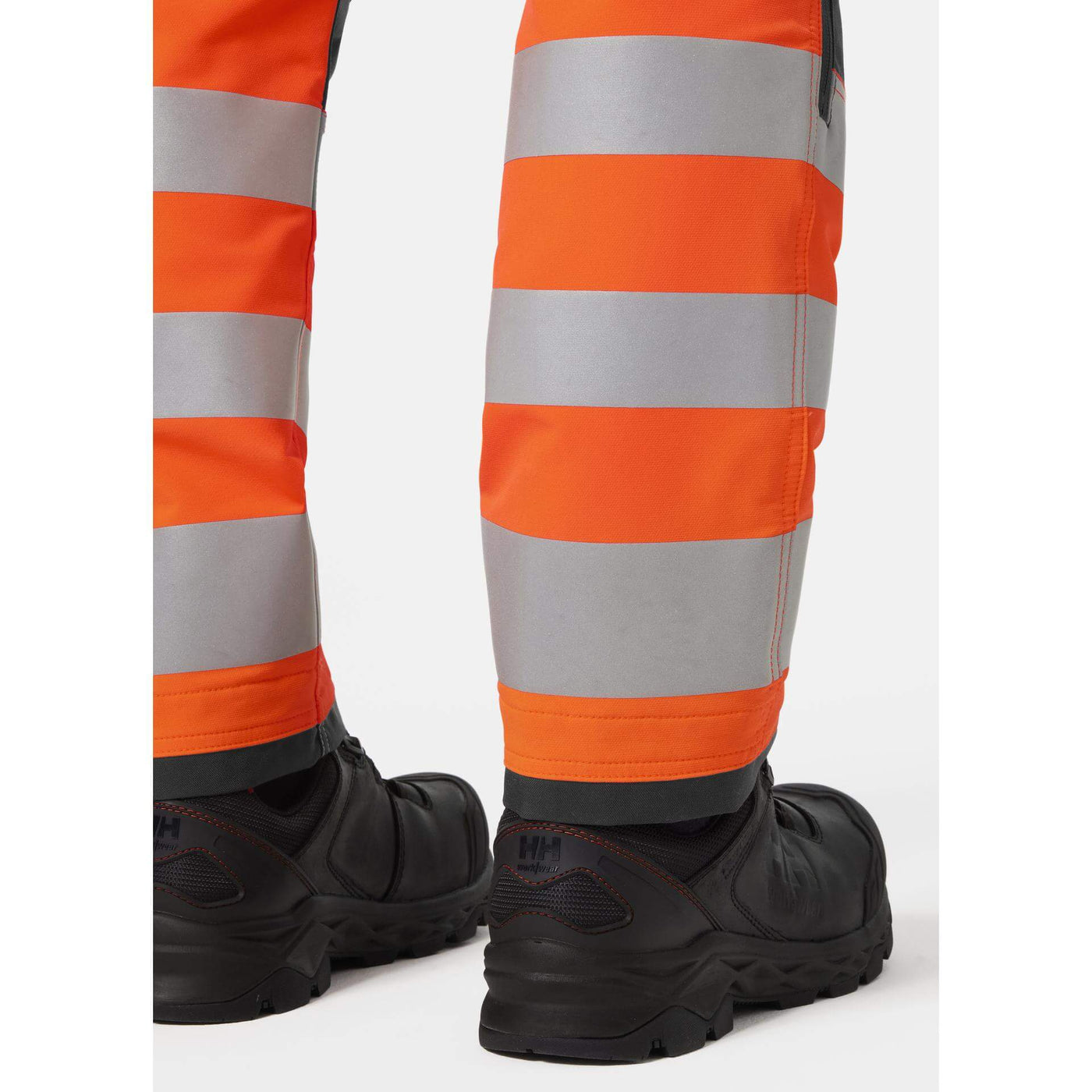 Helly Hansen Alna 4X Hi-Vis 4-Way-Stretch Construction Trousers Class 2 Orange/Ebony Feature 4#colour_orange-ebony