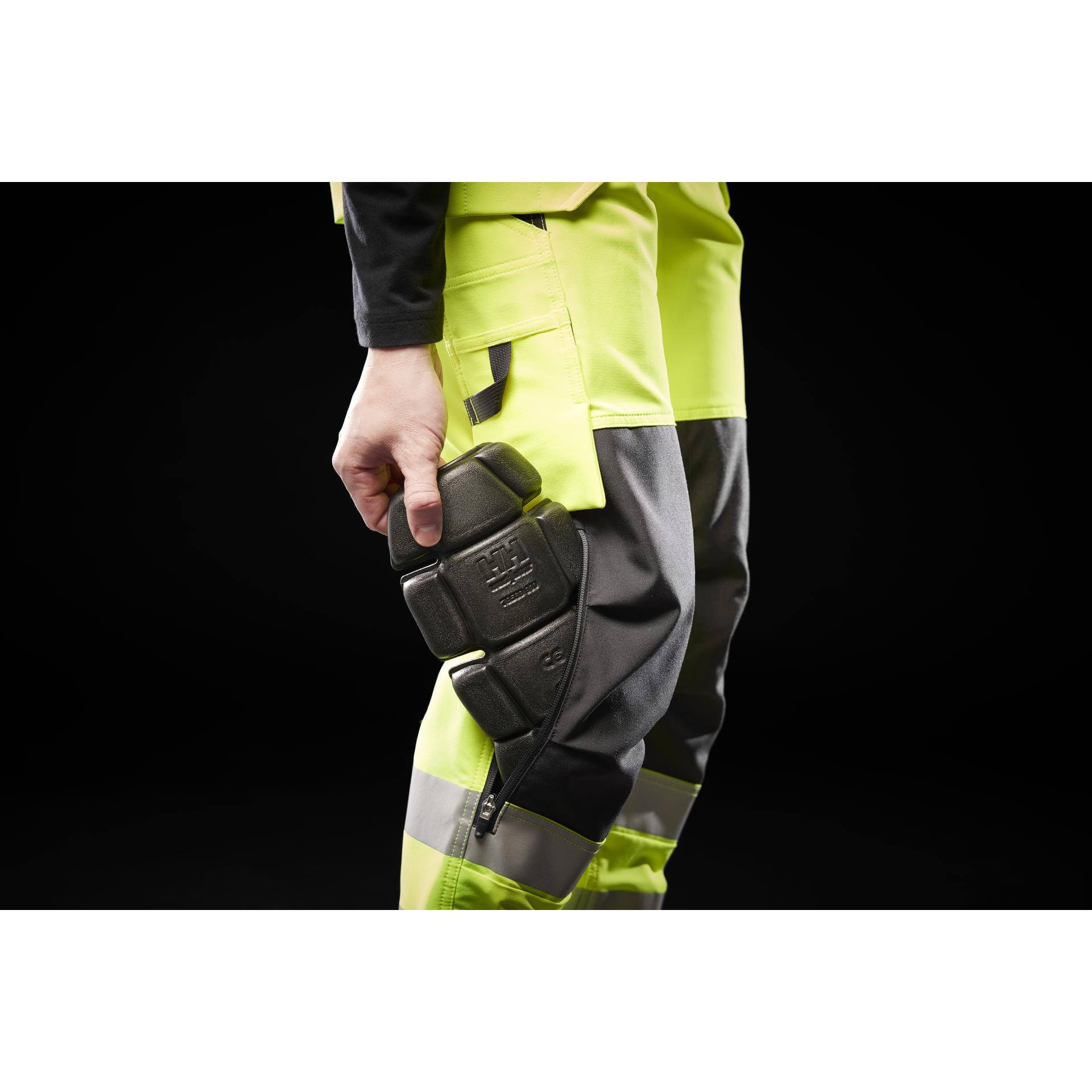 Helly Hansen Alna 4X Hi-Vis 4-Way-Stretch Construction Trousers Class 2 Yellow/Ebony Detail 1#colour_yellow-ebony