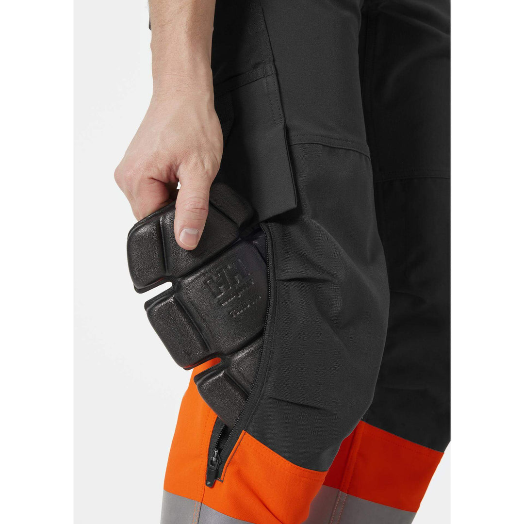 Helly Hansen Alna 4X Hi-Vis 4-Way-Stretch Work Trousers Class 1 Orange/Ebony Feature 2#colour_orange-ebony