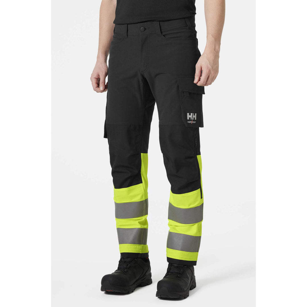 Helly Hansen Alna 4X Hi-Vis 4-Way-Stretch Work Trousers Class 1 Yellow/Ebony OnBody 1#colour_yellow-ebony