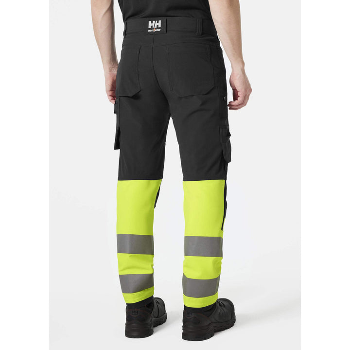 Helly Hansen Alna 4X Hi-Vis 4-Way-Stretch Work Trousers Class 1 Yellow/Ebony OnBody 2#colour_yellow-ebony