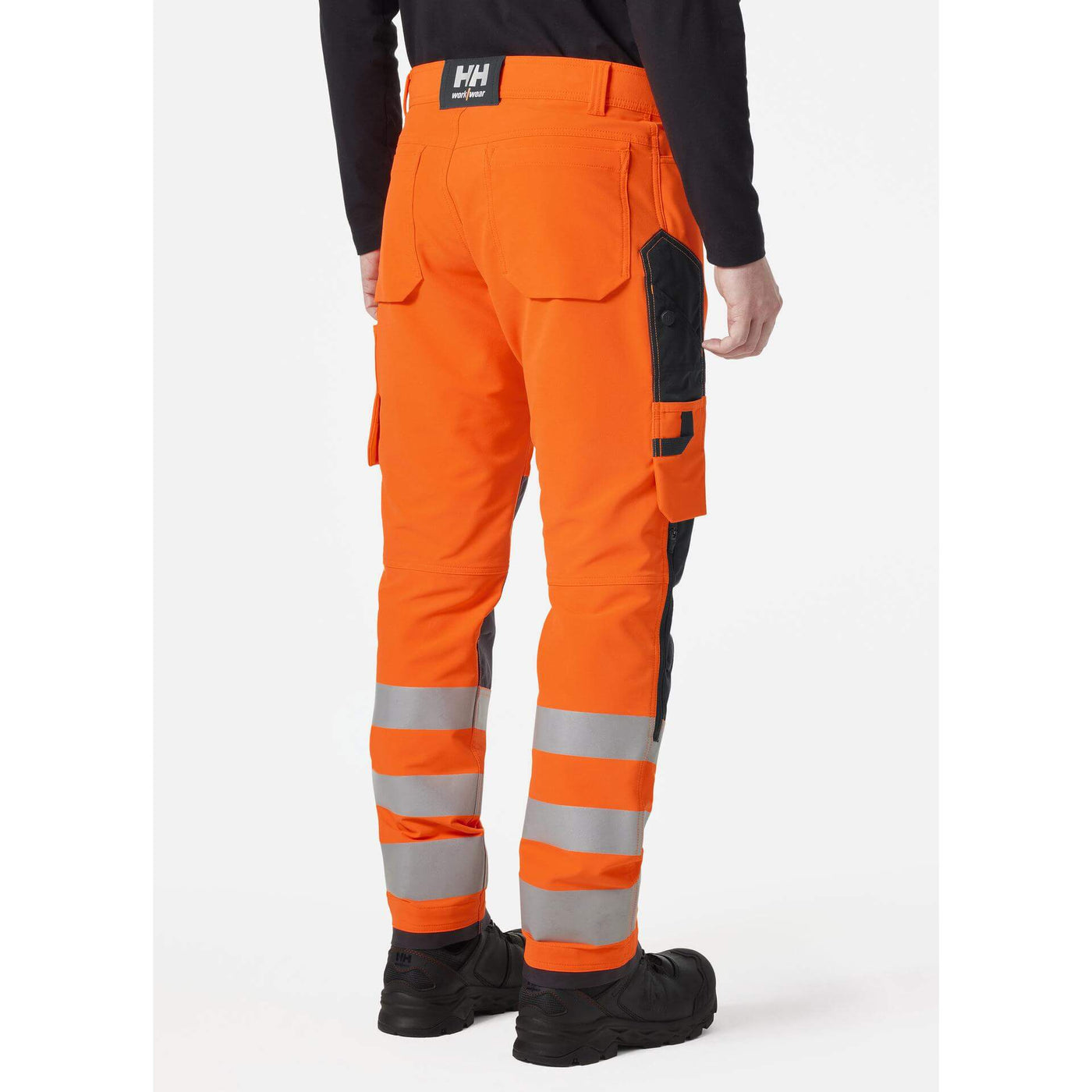 Helly Hansen Alna 4X Hi-Vis 4-Way-Stretch Work Trousers Class 2 Orange/Ebony OnBody 2#colour_orange-ebony