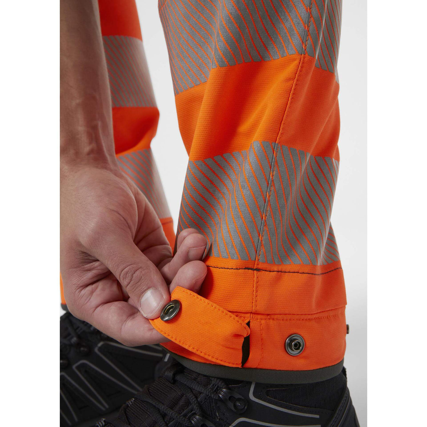 Helly Hansen ICU BRZ Hi Vis Service Work Trousers Class 1 Orange/Ebony 5 Feature 1#colour_orange-ebony