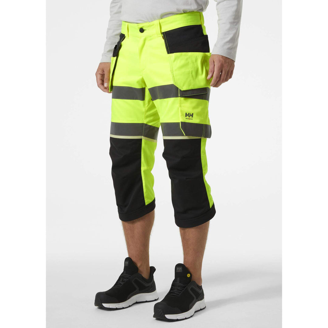 Helly Hansen UC-ME Hi-Vis Stretch Construction Pirate Trousers Yellow/Ebony OnBody 1#colour_yellow-ebony